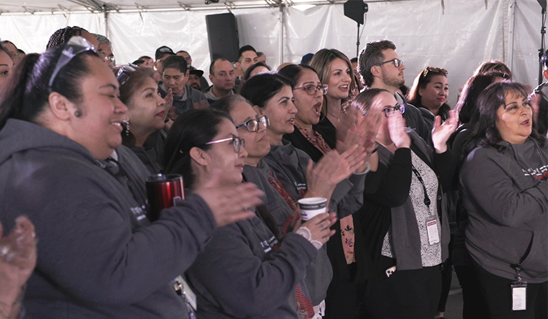 A group of CIRCOR International employees celebrate an announcement.
