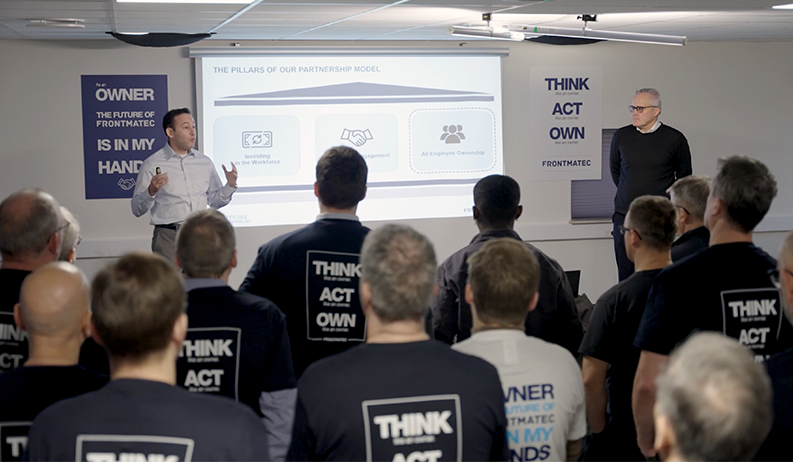 A group of Frontmatec employees gathered for a presentation.